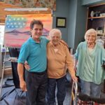 Residents with Painting and Artist
