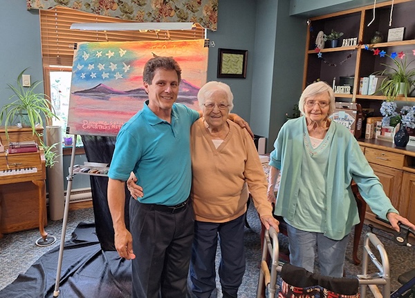 Residents with Painting and Artist
